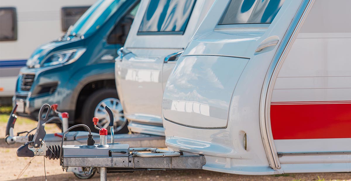 Caravan trailers beside a campervan