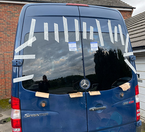 Camper-conversion---windows Converting a campervan - windows being installed on a blue Mercedes Sprinter