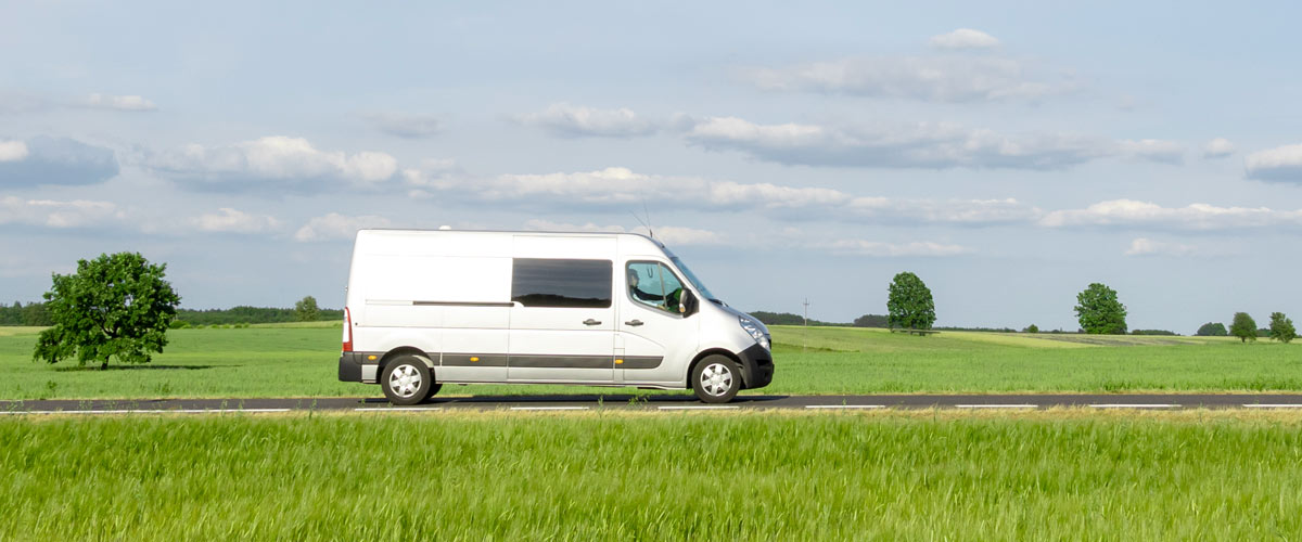 Converted-campervan-driving-in-the-countryside Converted campervan driving through the countryside