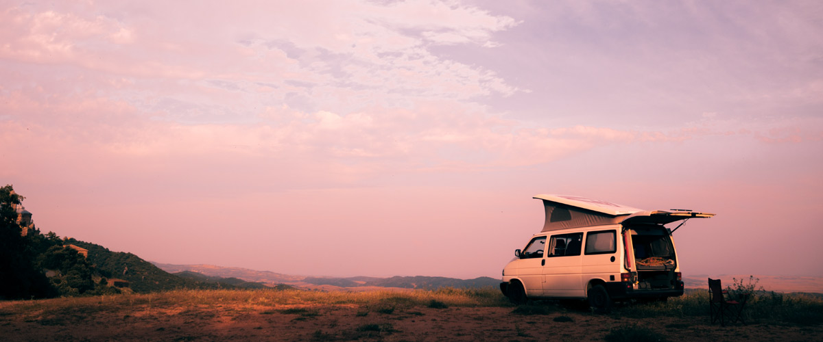 VW-T4-at-sunset VW T4 with a pop-top roof, parked on a hill for sunset