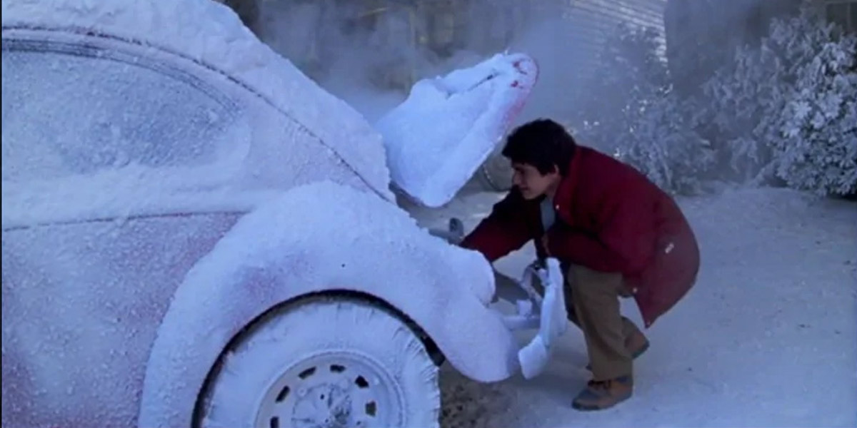 A scene from the Gremlins movie, with a VW Beetle covered in snow