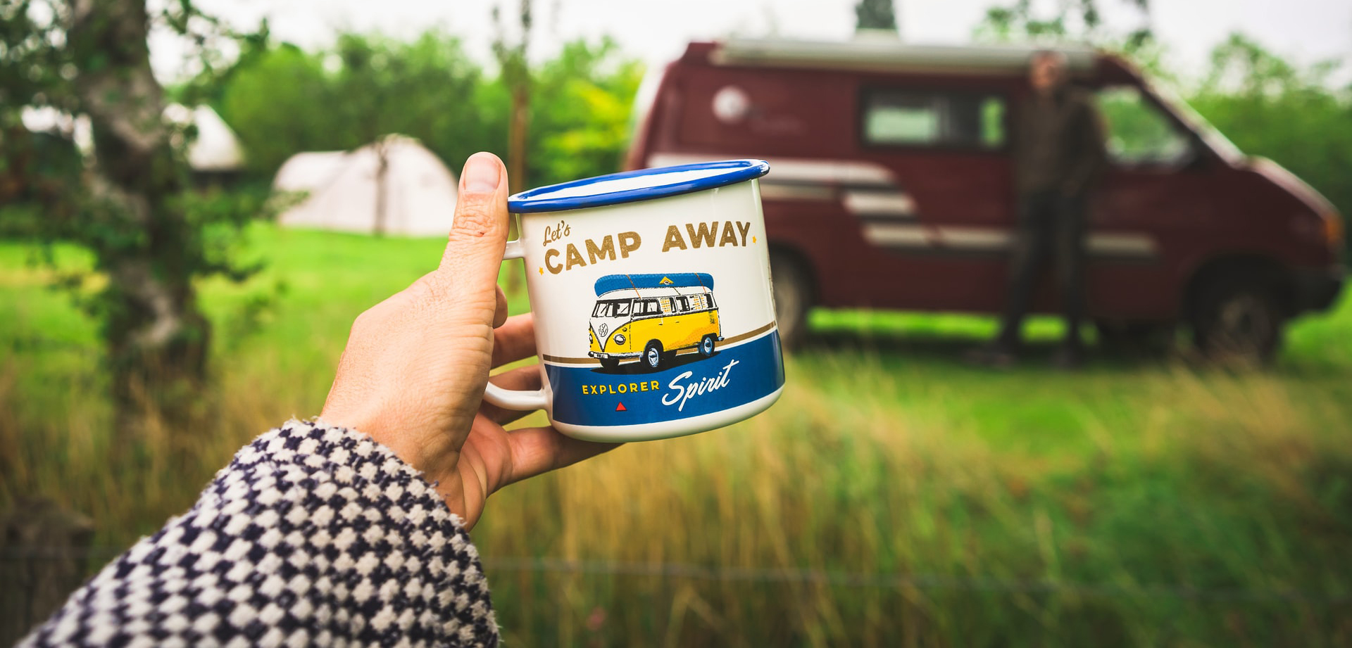 An image of a VW T4 Campervan with a blue and white camping mug