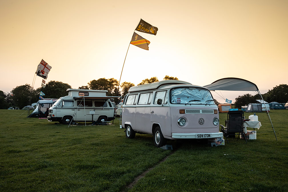 VW Campers in a field
