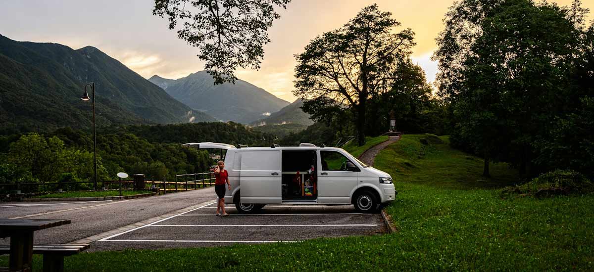 White VW campervan in a rural car park