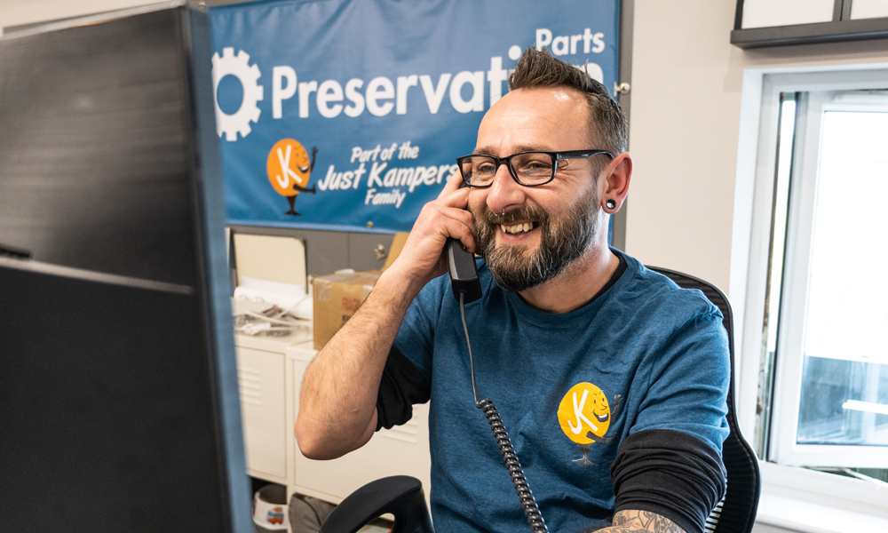 50-Price-Promise-Header-Image-for-Just-Kampers-Insurance Chet from Just Kampers on the phone with a customer