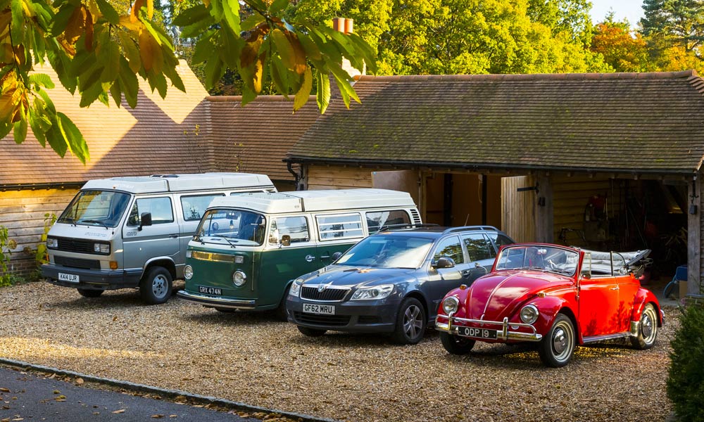 JKI25-Multi-Car-Image-Header-1 A VW T25, a VW T2 Bay, a Skoda, and a VW Beetle Cabriolet parked up next to each other