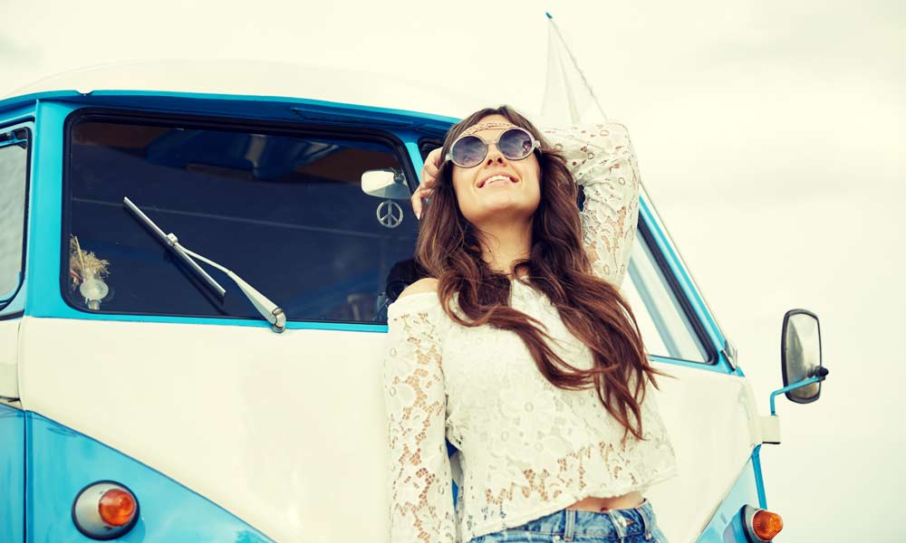 JKI25-Under-25-Camper-Van-Insurance-Header-1 A young woman with a VW T25 Campervan