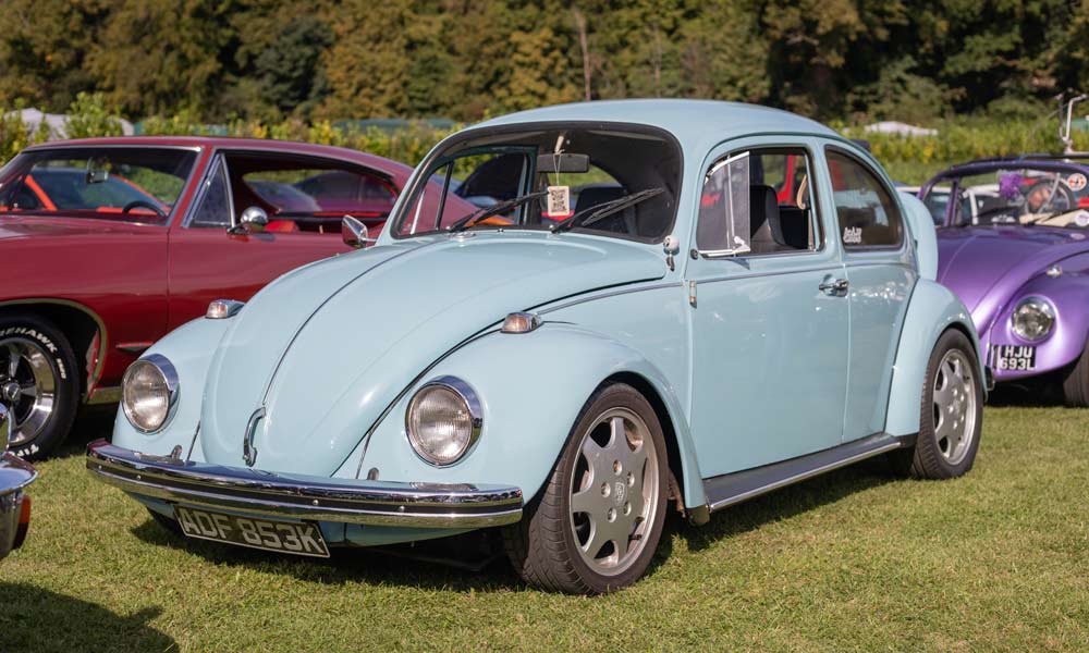 JKI25-VW-Beetle-Image-Header-1 A blue Volkswagen Beetle parked up at a classic car show