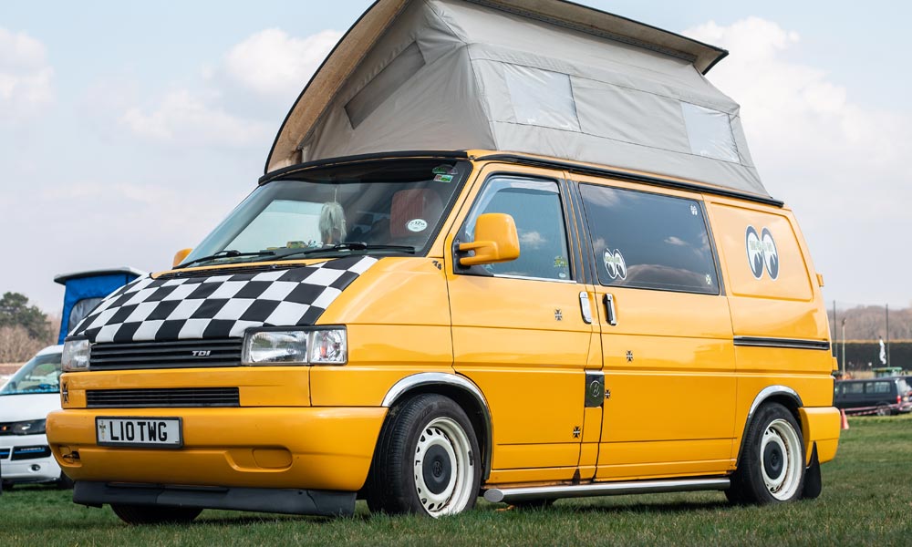 JKI25-VW-T4-Insurance-Header-1 A modified VW T4 Transporter with the elevated roof raised, lowered suspension, and custom stickers