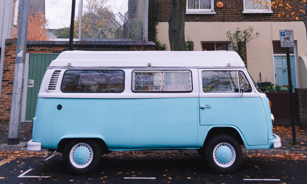 Legal-Protection-Cover-Image-for-Just-Kampers-Insurance A classic VW camper parked on a residential road