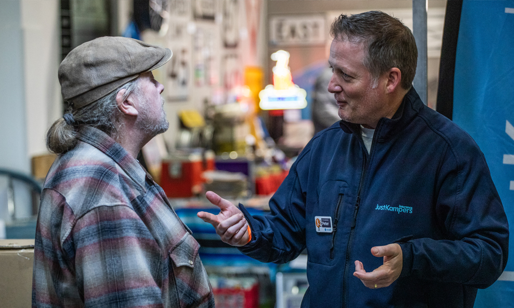 Optional-Policy-Benefits-Header-Image-for-Just-Kampers-Insurance Peter from Just Kampers Insurance speaking with a customer at a classic car event