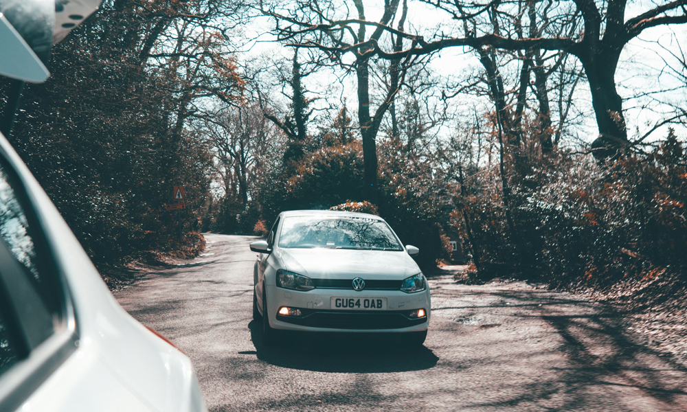 Replacement-Car-Cover-Header-Image-for-Just-Kampers-Insurance A photo of a white VW arriving
