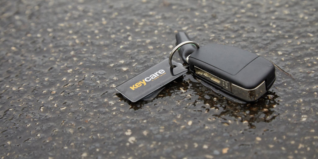 Key-Care-Image-for-Just-Kampers-Insurance A misplaced key with a Key Care fob attached to it