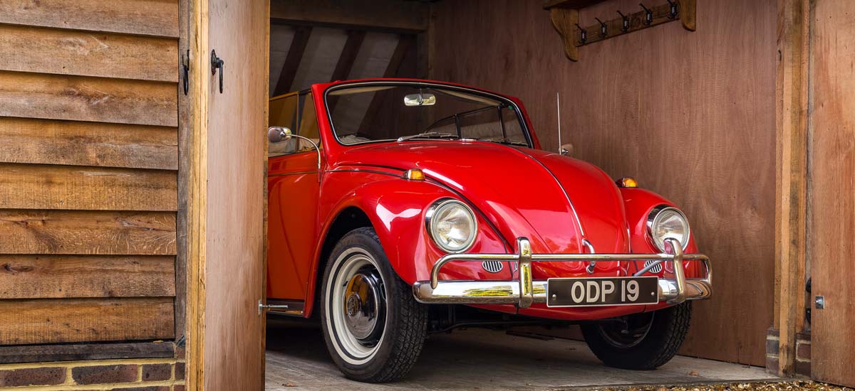 Red-Cabriolet A red classic VW Beetle Cabriolet with a classic number plate