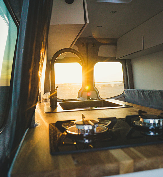 Sunlight shining in through a campervan