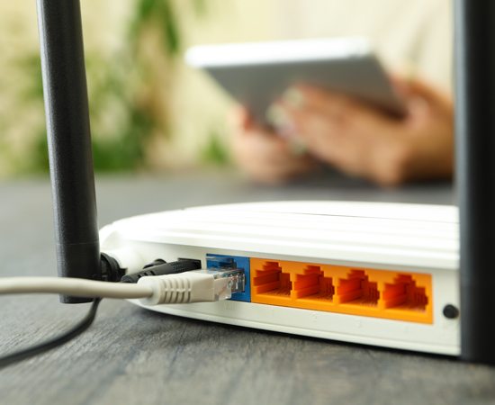White Wi-Fi router on a table