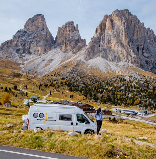 Campervan parked in front of the mountains