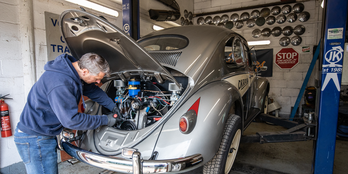 A classic VW Beetle being worked on inside the on-site workshop at our sister company, Just Kampers