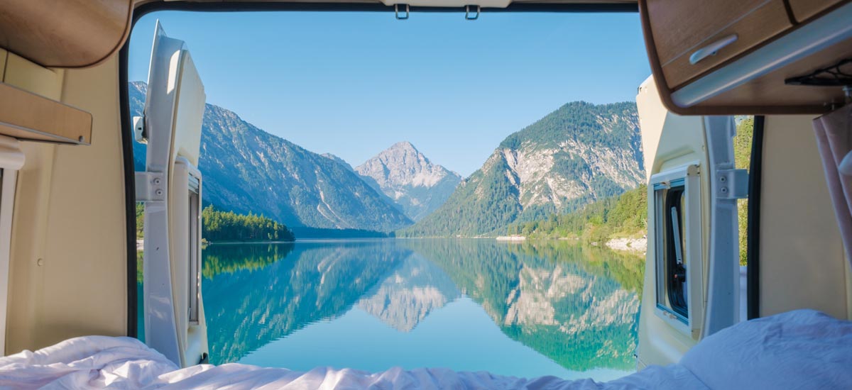 View of a lake from a campervan