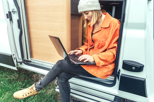 Lady working from a van