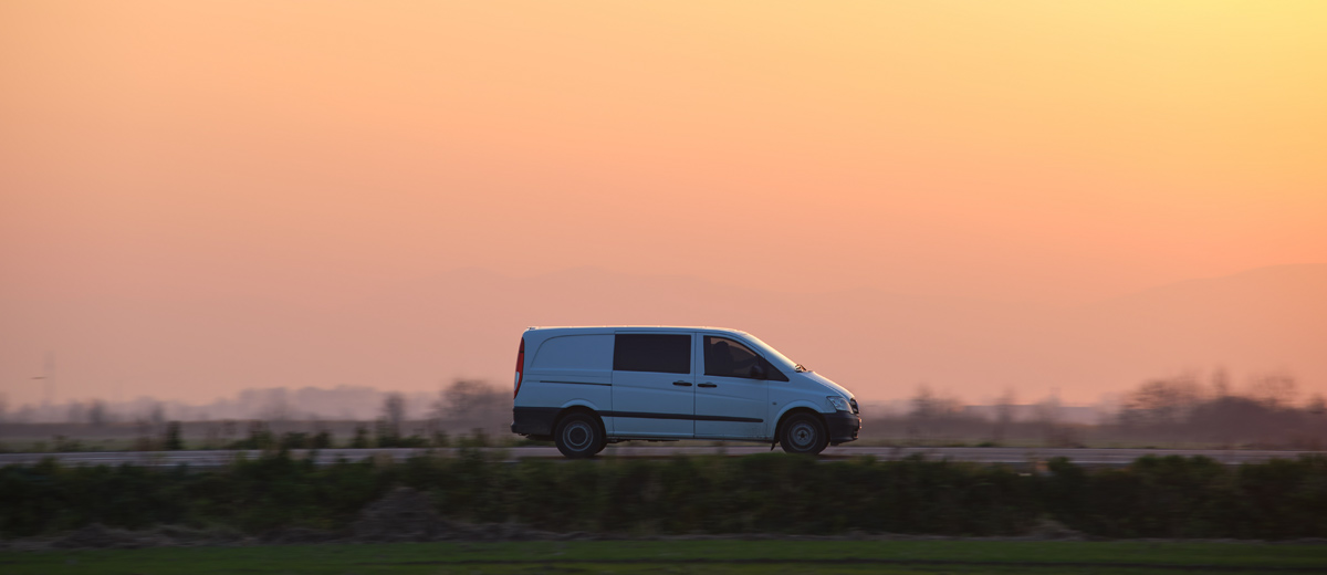 Campervan driving at sunset