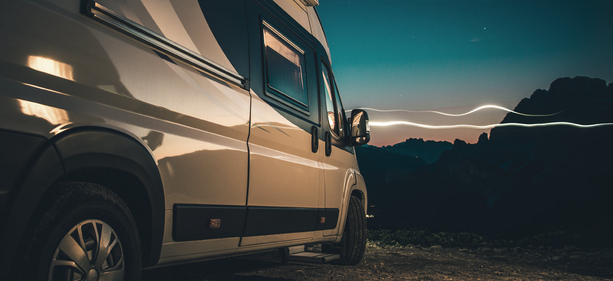Campervan in the mountains at night