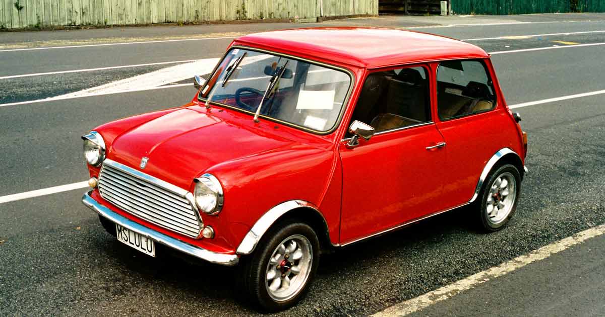 Red classic Mini parked on the road